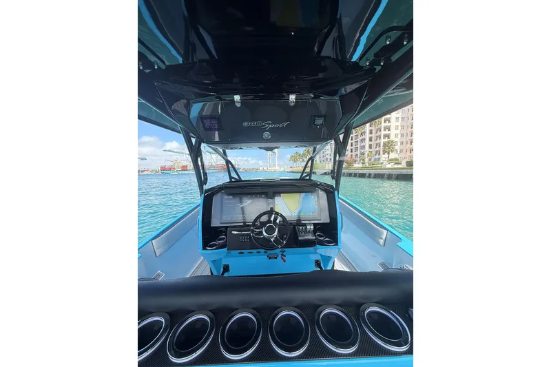 Slide: The Image of 2025 Nor-Tech 340 Sport Center Console boat interior with advanced navigation system. - 10