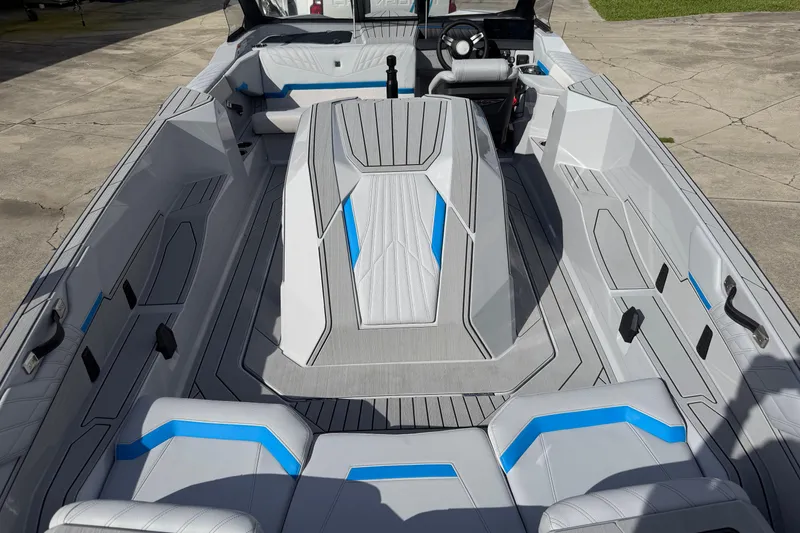 Slide: The Image of 2026 Nautique Ski Nautique boat interior with modern seating and sleek design. - 13