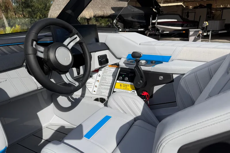 Slide: The Image of 2026 Nautique Ski Nautique boat interior with modern steering and control panel. - 15