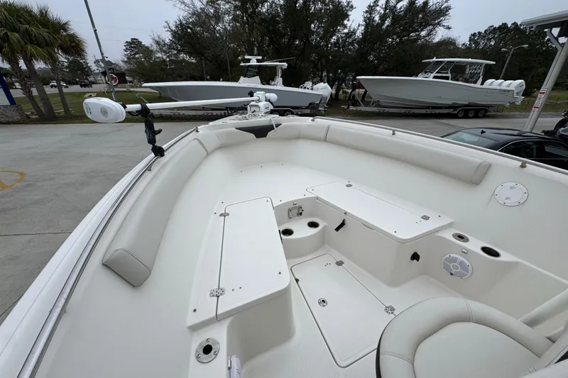 Slide: The Image of 2022 Sailfish 242 CC boat interior with seating and storage compartments. - 16