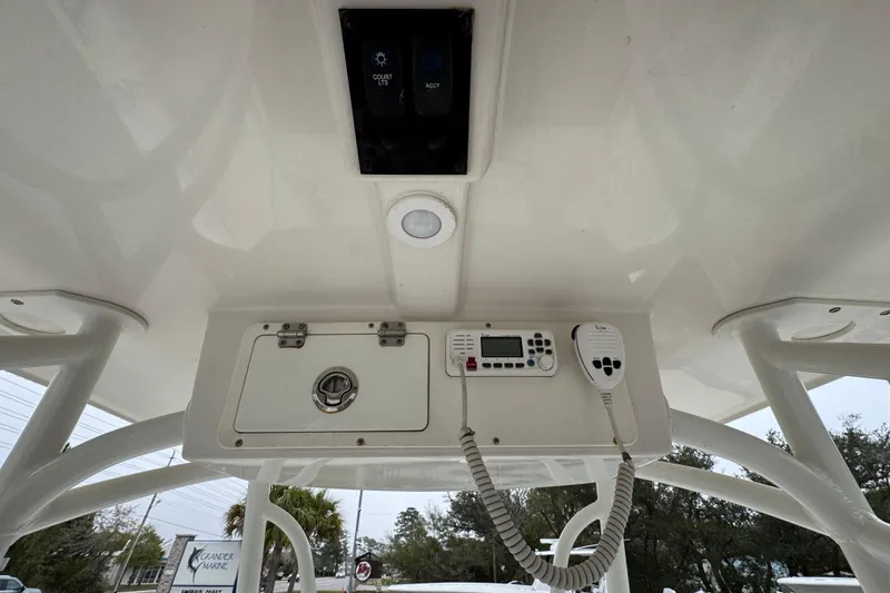 Slide: The Image of 2022 Sailfish 242 CC boat console with radio and control panel. - 31