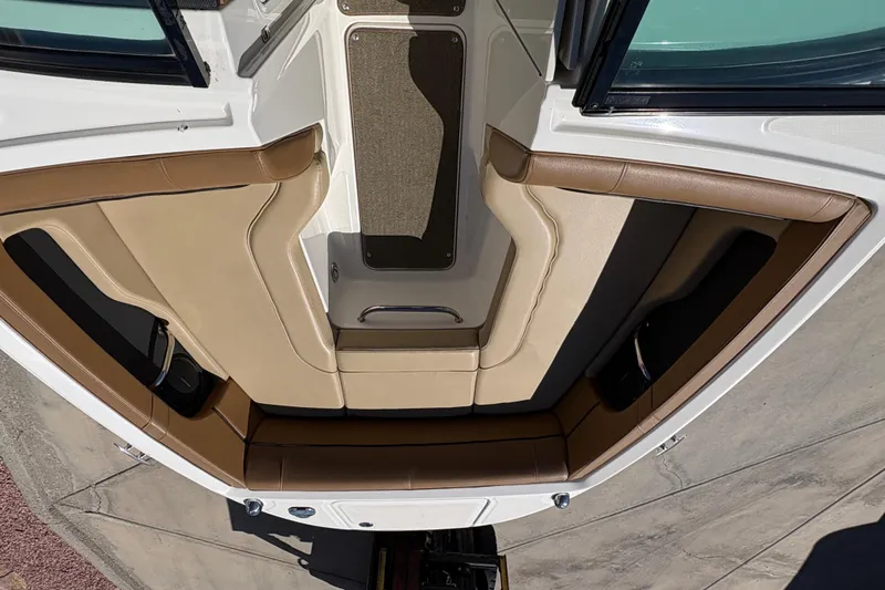 Slide: The Image of Interior of 2015 Sea Ray 220 Sundeck with beige seating. - 13