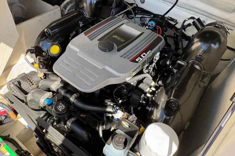 Slide: The Image of Engine of 2015 Sea Ray 220 Sundeck boat, featuring a 5.0 MPI motor. - 18