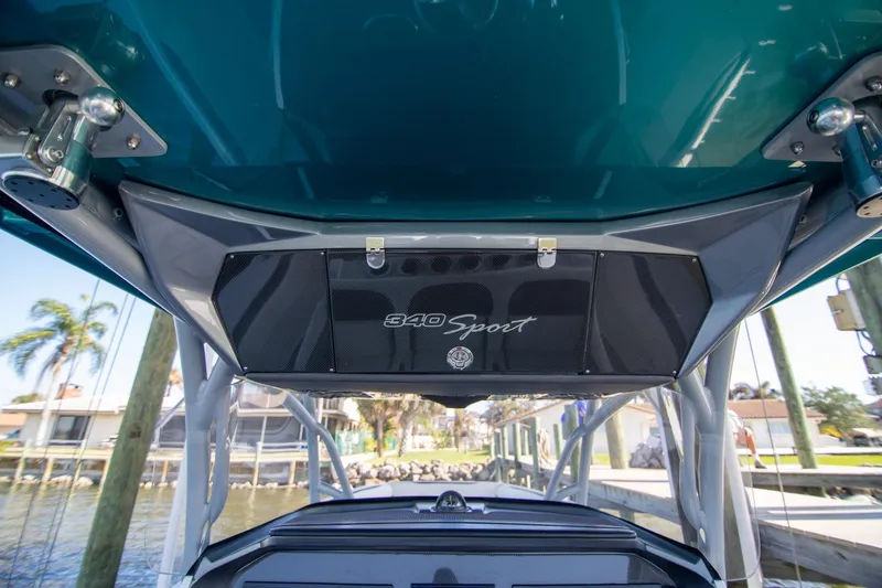Slide: The Image of 2018 Nor-Tech 340 Sport Center Console boat, featuring sleek design and modern amenities. - 14