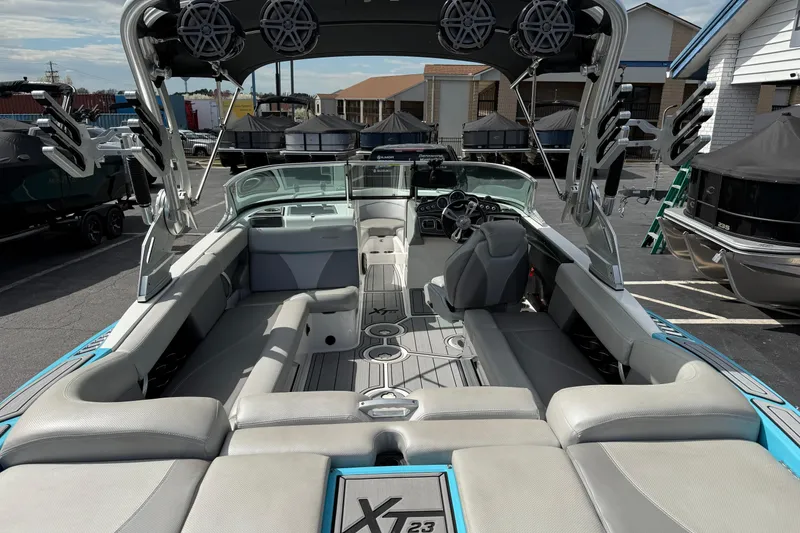 Slide: The Image of 2017 MasterCraft XT23 boat interior with spacious seating and modern design. - 11