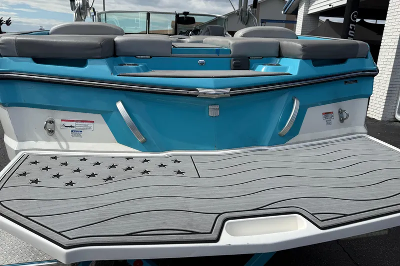 Slide: The Image of 2017 MasterCraft XT23 boat with American flag design on swim platform. - 3