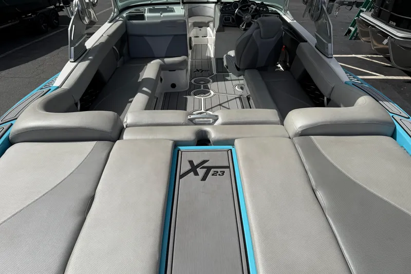 Slide: The Image of 2017 MasterCraft XT23 boat interior with spacious seating and modern design. - 4
