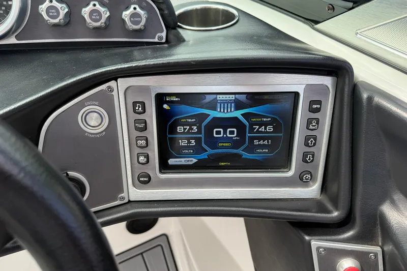 Slide: The Image of 2017 MasterCraft XT23 dashboard with digital display showing air and water temperature. - 7