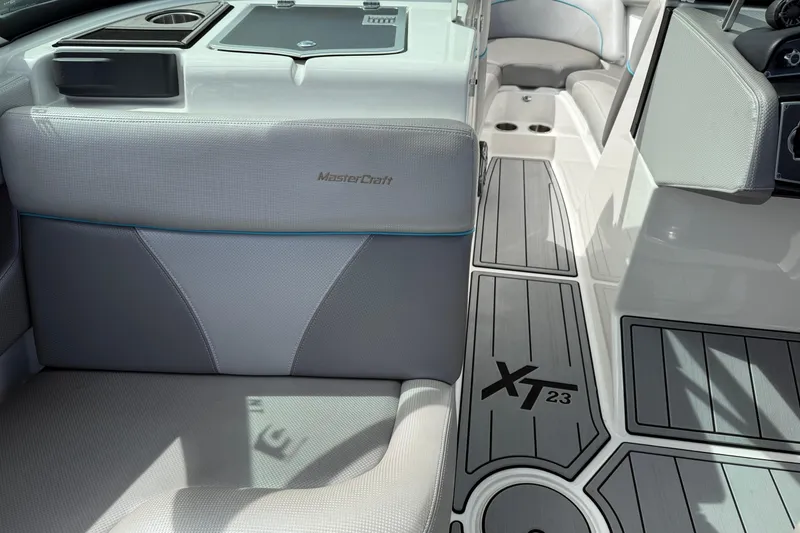 Slide: The Image of 2017 MasterCraft XT23 boat interior with sleek seating and modern design. - 9