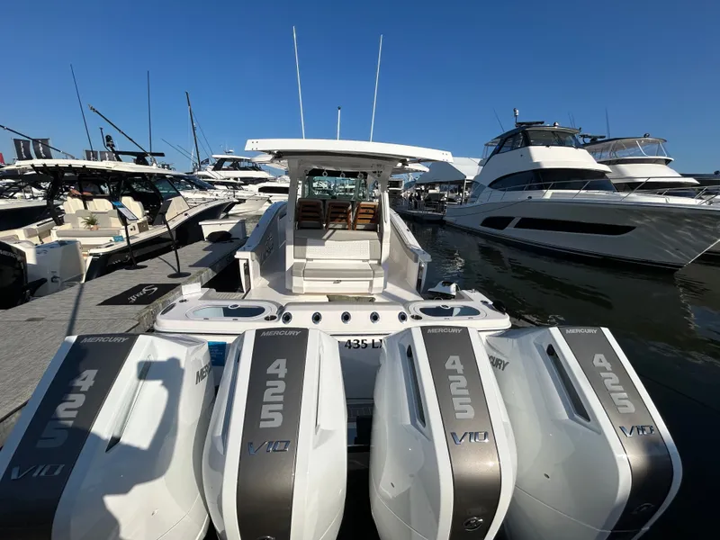 Slide: The Image of Scout 435 LXF 2026 with four Mercury 425 V10 engines at the dock. - 12
