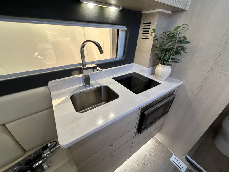 Slide: The Image of Modern kitchen in Scout 435 LXF 2026 boat. - 13