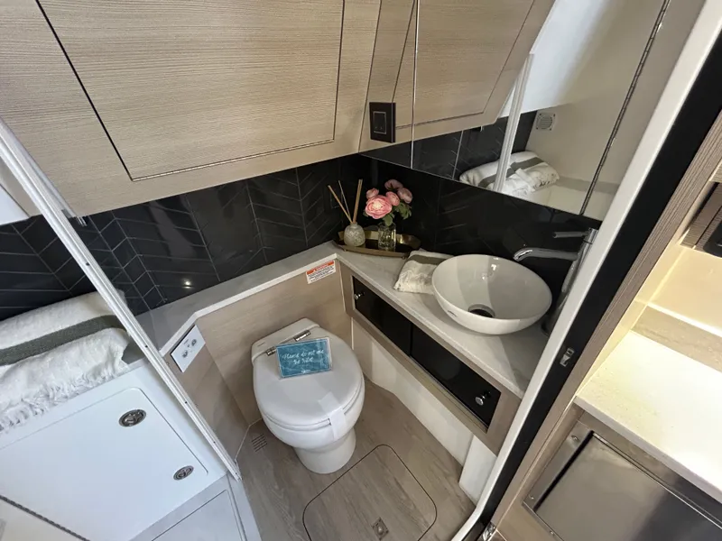Slide: The Image of Luxurious bathroom in Scout 435 LXF boat, model year 2026. - 14