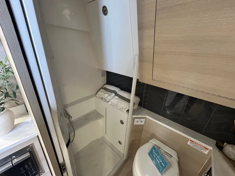 Slide: The Image of Luxurious bathroom in Scout 435 LXF boat, model year 2026. - 15