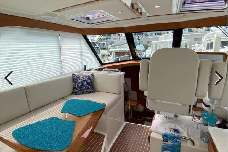 Slide: The Image of Interior of 2022 Back Cove 39O yacht with seating and helm station. - 11