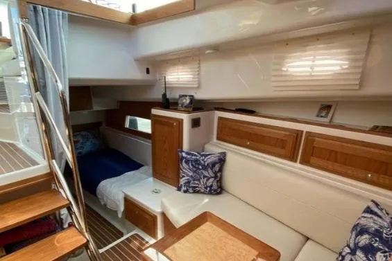 Slide: The Image of Luxurious interior of 2022 Back Cove 39O yacht with cozy seating and elegant wood finishes. - 15