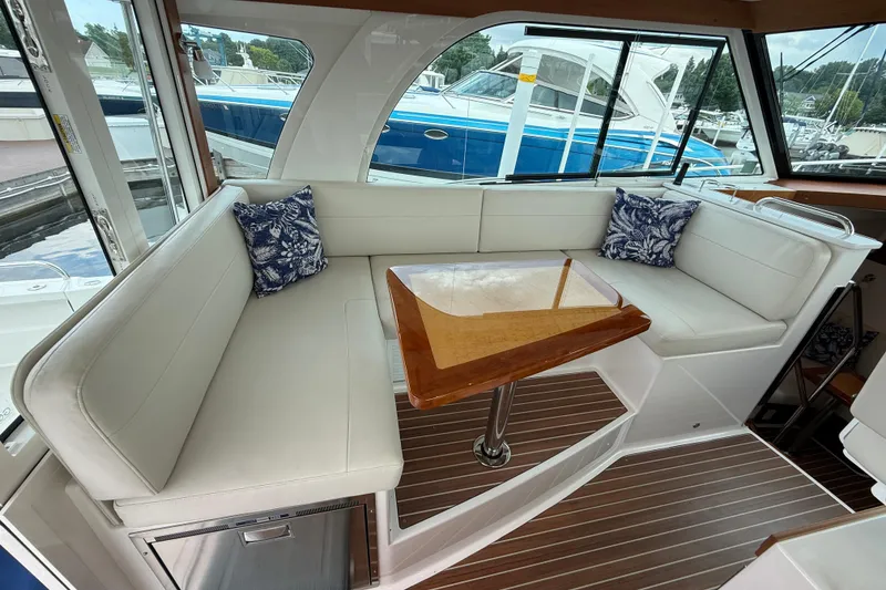 Slide: The Image of Luxurious interior of 2022 Back Cove 39O yacht with elegant seating and wooden table. - 31