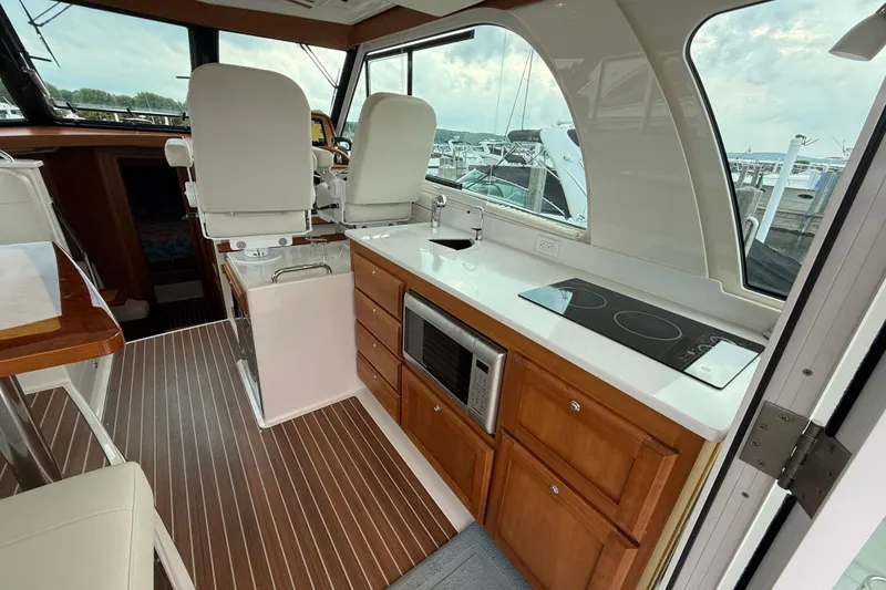 Slide: The Image of Interior of 2022 Back Cove 39O yacht with modern kitchen and helm seating. - 35