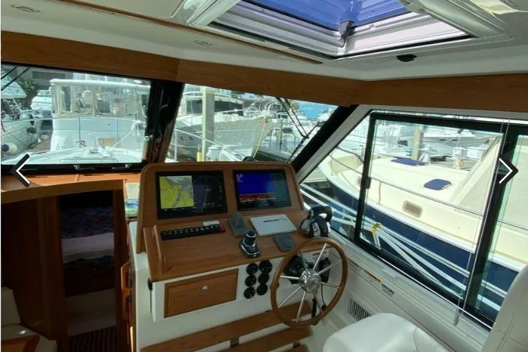 Slide: The Image of Interior view of 2022 Back Cove 39O yacht cockpit with navigation equipment. - 18