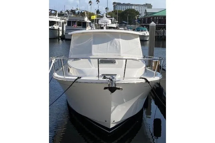 Slide: The Image of 2022 Back Cove 39O boat docked in marina, front view. - 2