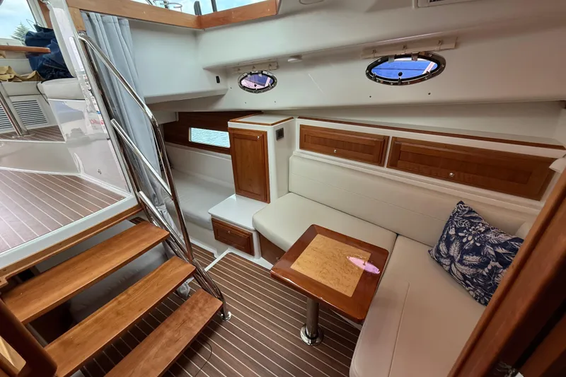 Slide: The Image of Interior of 2022 Back Cove 39O yacht with wooden stairs, seating, and nautical decor. - 53