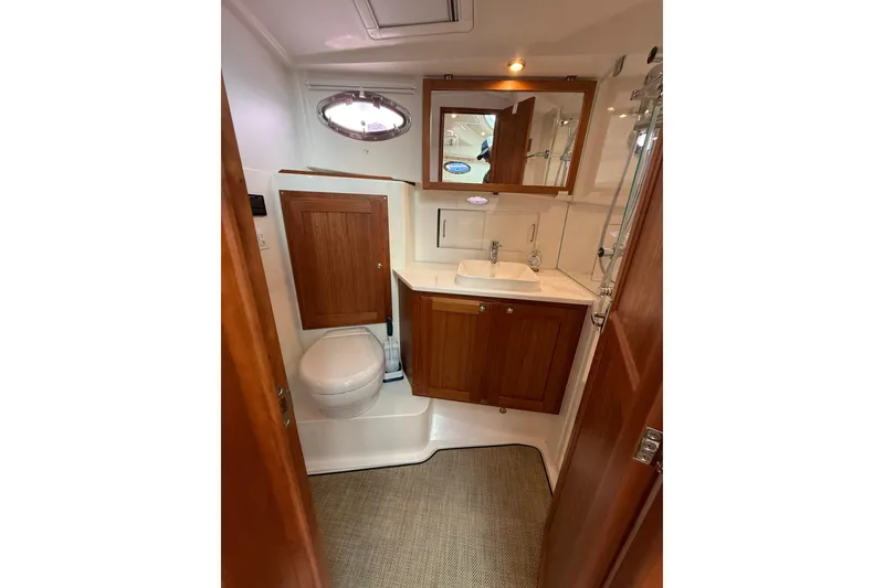 Slide: The Image of Luxurious bathroom in 2022 Back Cove 39O yacht with wooden cabinetry and modern fixtures. - 63