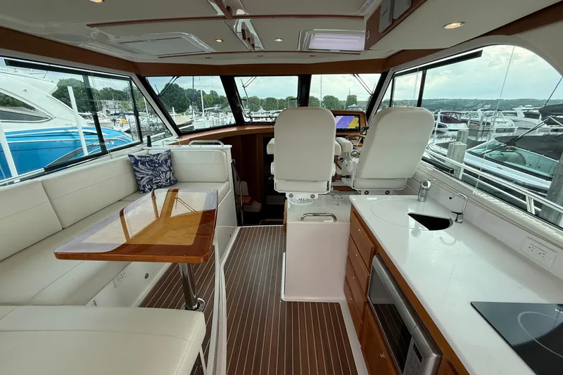 Slide: The Image of Luxurious interior of 2022 Back Cove 39O yacht with modern kitchen and seating area. - 28