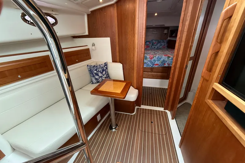 Slide: The Image of Luxurious interior of 2022 Back Cove 39O yacht with elegant wood finishes and cozy seating. - 51