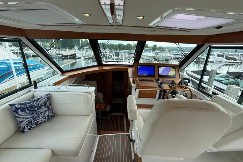 Slide: The Image of Luxurious 2022 Back Cove 39O yacht interior with modern helm and plush seating. - 38