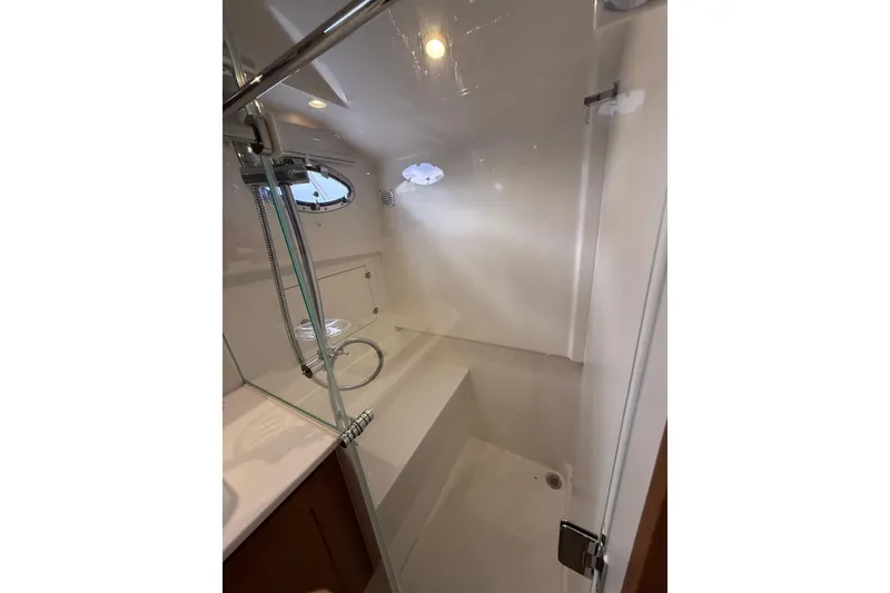 Slide: The Image of Luxurious shower area in 2022 Back Cove 39O yacht, featuring sleek design and modern fixtures. - 66
