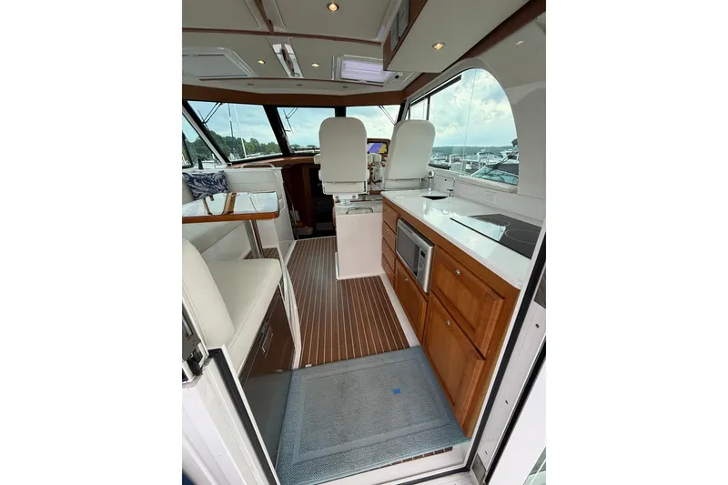 Slide: The Image of Interior of 2022 Back Cove 39O yacht with modern kitchen and seating area. - 26
