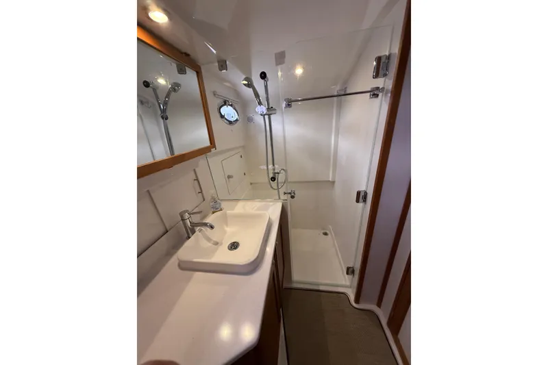 Slide: The Image of Luxurious bathroom in 2022 Back Cove 39O yacht with modern fixtures and glass shower. - 67