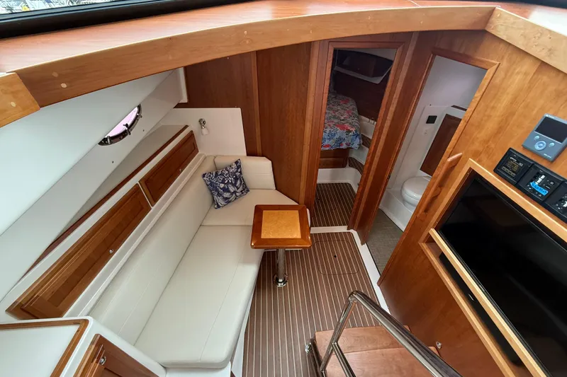 Slide: The Image of Interior of 2022 Back Cove 39O yacht with seating, table, and cabin amenities. - 49