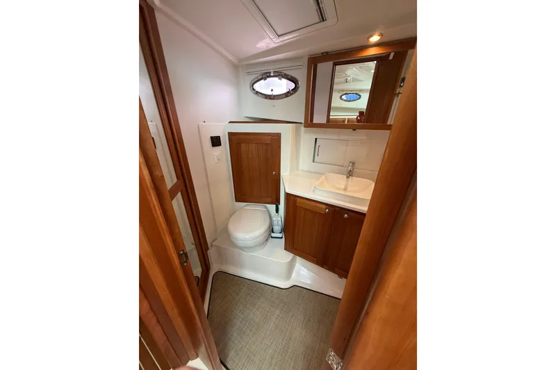 Slide: The Image of 2022 Back Cove 39O yacht bathroom with wooden cabinets and modern fixtures. - 64