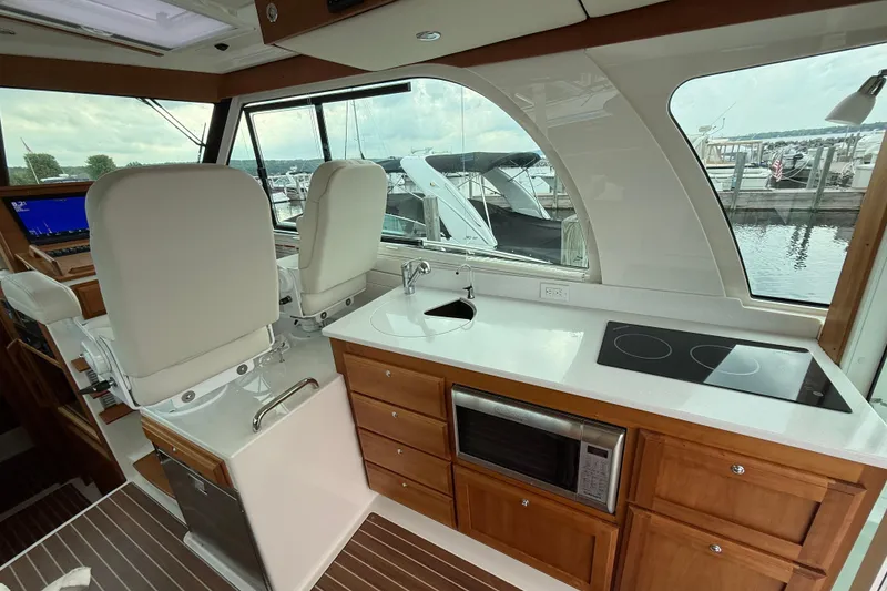 Slide: The Image of Interior of 2022 Back Cove 39O yacht with modern kitchen and helm station. - 37