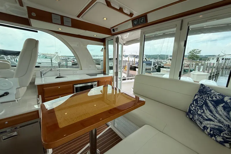 Slide: The Image of Interior of 2022 Back Cove 39O yacht with elegant seating and marina view. - 34