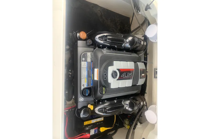 Slide: The Image of Engine compartment of a 2018 Crownline 205 SS boat, featuring a 4.5L engine. - 22