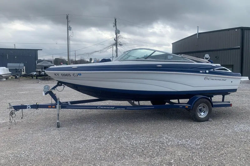 Slide: The Image of 2018 Crownline 205 SS boat on trailer in outdoor storage area. - 4