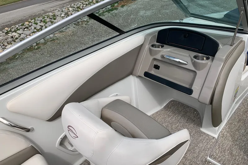 Slide: The Image of 2018 Crownline 205 SS boat interior with seating and cup holders. - 9