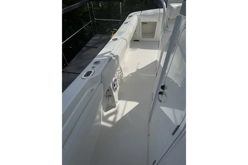 Slide: The Image of 2021 Regulator 25 boat interior with white deck and seating. - 6