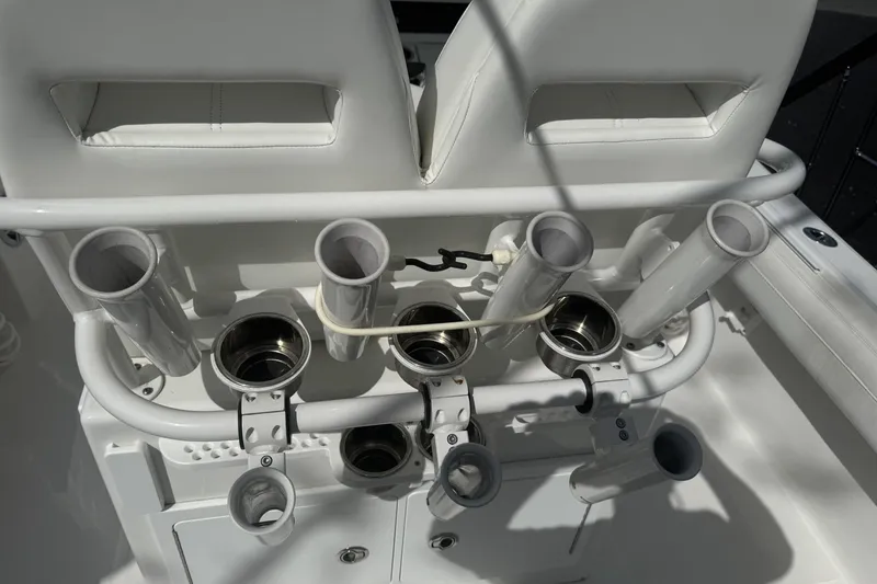 Slide: The Image of 2021 Regulator 25 boat rod holders and seating detail in bright sunlight. - 7