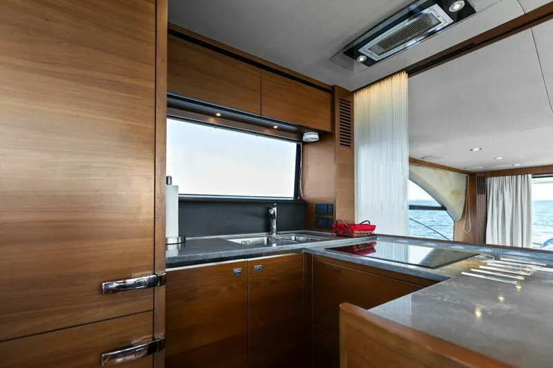Slide: The Image of Luxurious kitchen interior of 2016 Princess 60 Flybridge yacht with ocean view. - 14