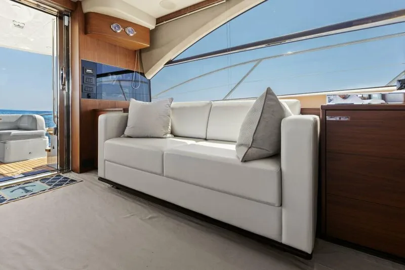 Slide: The Image of Luxurious interior of 2016 Princess 60 Flybridge yacht with white sofa and ocean view. - 16