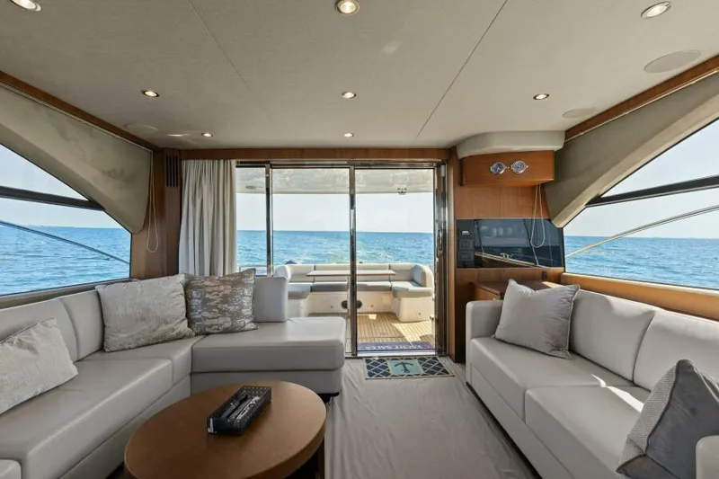 Slide: The Image of Luxurious 2016 Princess 60 Flybridge yacht interior with ocean view and elegant seating area. - 22