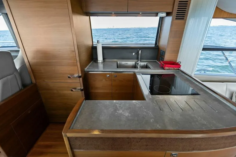 Slide: The Image of Modern kitchen on 2016 Princess 60 Flybridge yacht with ocean view. - 26