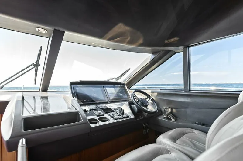Slide: The Image of Luxurious 2016 Princess 60 Flybridge yacht cockpit with modern navigation controls. - 29