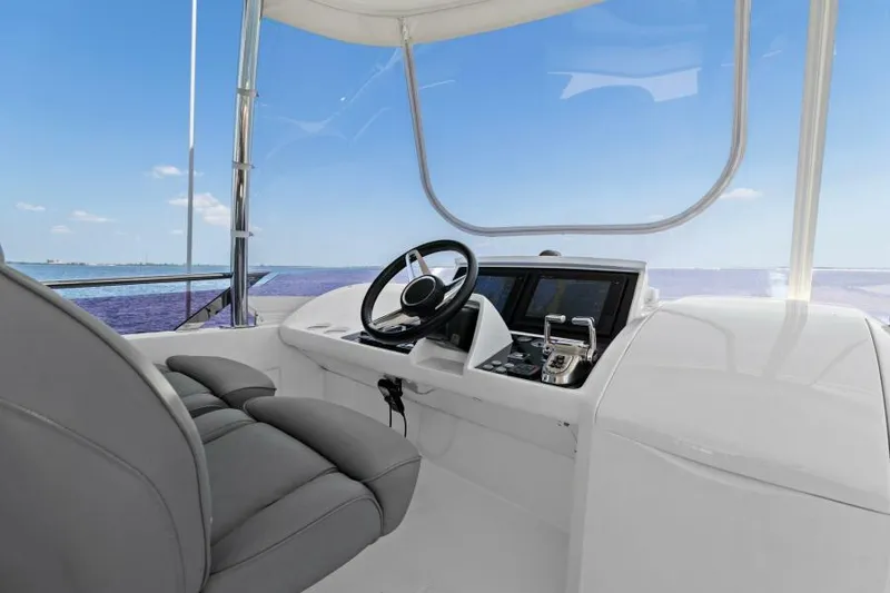 Slide: The Image of Flybridge helm of 2016 Princess 60 yacht with ocean view. - 3