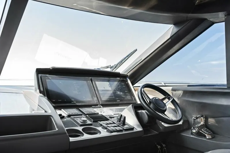 Slide: The Image of Helm of 2016 Princess 60 Flybridge yacht with modern controls and navigation screens. - 30