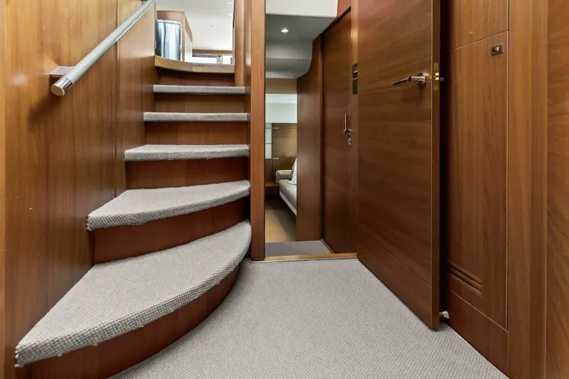 Slide: The Image of Interior of 2016 Princess 60 Flybridge yacht with wooden staircase and modern design. - 32