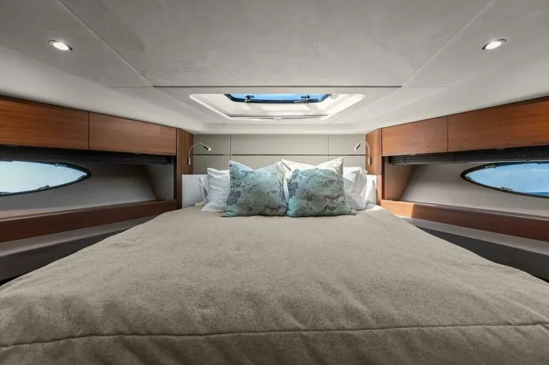 Slide: The Image of Luxurious bedroom interior of 2016 Princess 60 Flybridge yacht with skylight and elegant bedding. - 41
