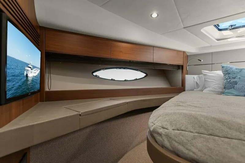 Slide: The Image of Luxurious cabin interior of 2016 Princess 60 Flybridge yacht with cozy bed and porthole view. - 45